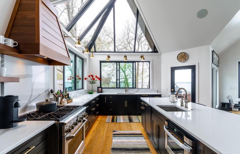 Black and white lake house kitchen after renovation