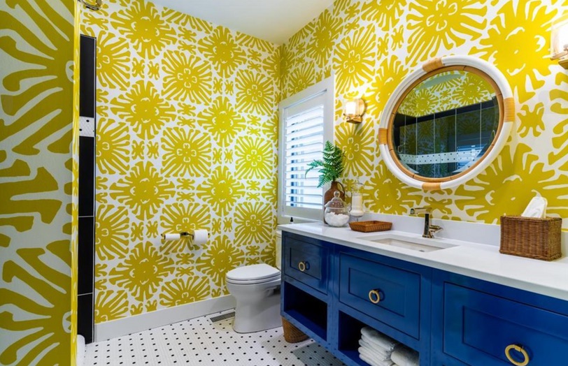 Colorful yellow and blue lake house bathroom after renovation