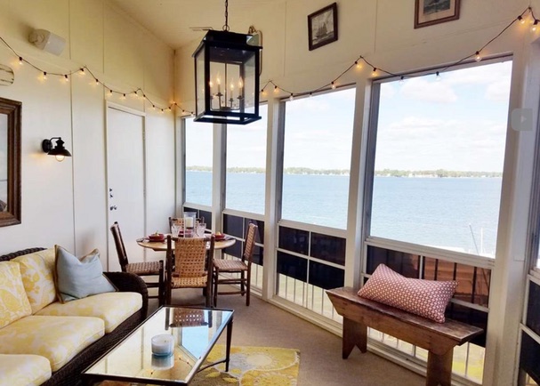 Bright screened porch after refresh with an uninterrupted lake view