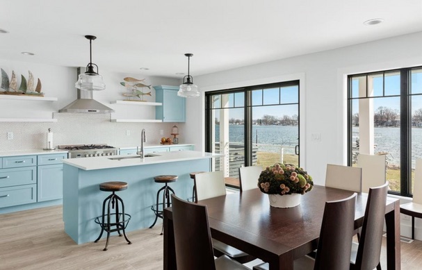 Soft blue kitchen and dining room overlooking Syracuse Lake